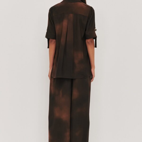 Aje clothing Aus Tops – structured silhouette with raw femininity from Coveti