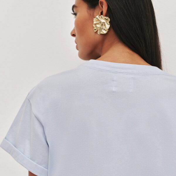 Aje Aus Tops – structured silhouette with raw femininity from Coveti