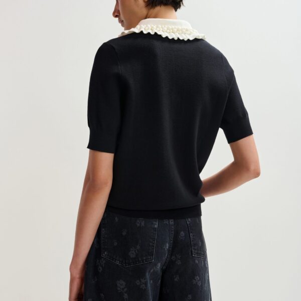 Essentiel Antwerp Black and off-white ruffle fine-knit polo top with bead embellishments - Essentiel Antwerp Tops - Colorful Belgian Design - Shop at Coveti