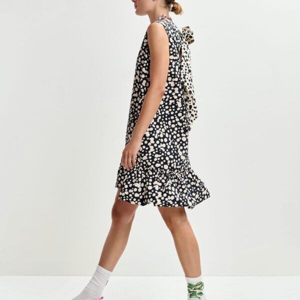 Essentiel Antwerp Black and white ruffled mini dress with open-back and bow detail - Essentiel Antwerp Dresses - Colorful Belgian Design - Shop at Coveti