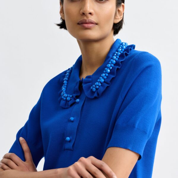 Essentiel Antwerp Blue ruffle fine-knit polo top with bead embellishments - Essentiel Antwerp Tops - Colorful Belgian Design - Shop at Coveti