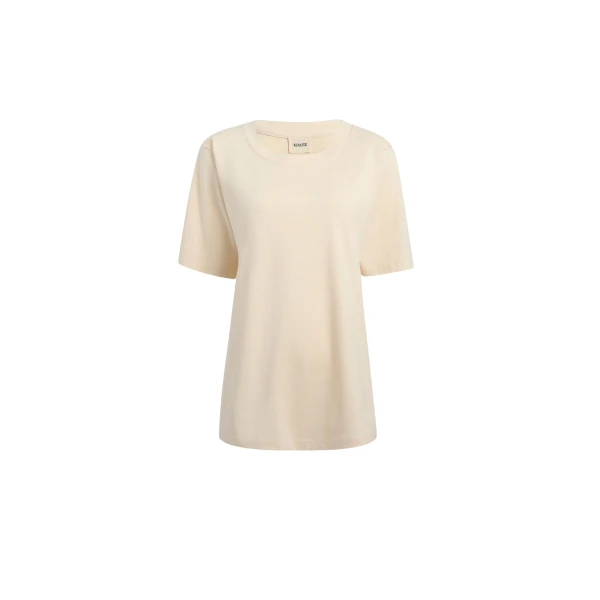 Elevate your elegance in this Khaite Tops   from the 2025 resort wear edit