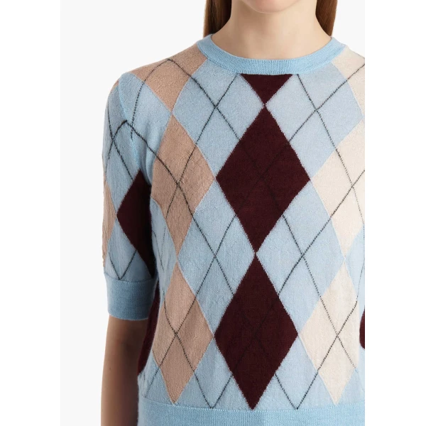 Elevate your elegance in this Khaite Tops   from the 2025 resort wear edit