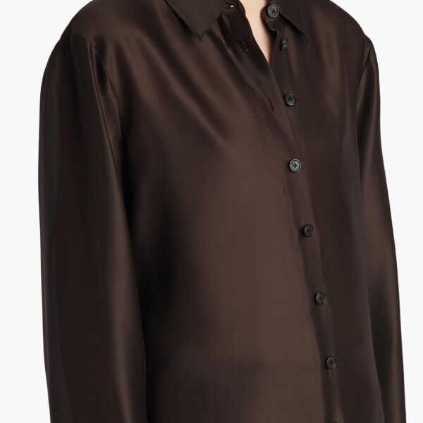 Elevate your elegance in this Khaite Tops   from the 2025 resort wear edit