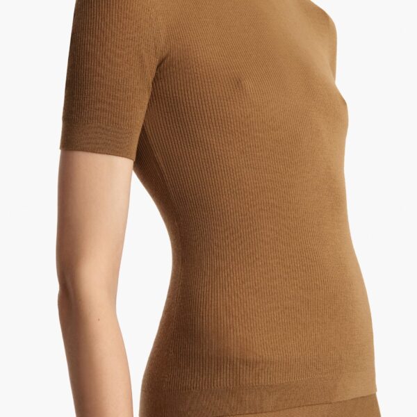 Elevate your elegance in this Khaite Tops   from the 2025 resort wear edit