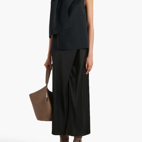 Elevate your elegance in this Khaite Tops   from the 2025 resort wear edit