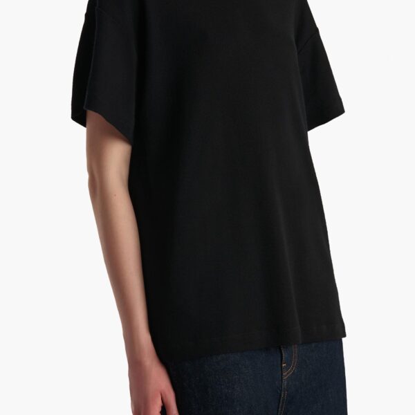 Elevate your elegance in this Khaite Tops   from the 2025 resort wear edit