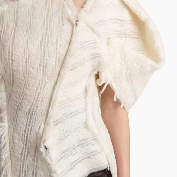 Elevate your elegance in this Khaite Tops   from the 2025 resort wear edit