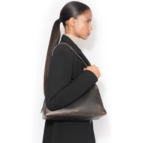 Alaïa Le Bouledogue Bag In Aged Leather - Alaia Bags - Laser Cut Luxury - Shop at Coveti