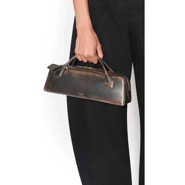 Alaïa Le Teckel Clutch In Aged Leather - Alaia Bags - Laser Cut Luxury - Shop at Coveti