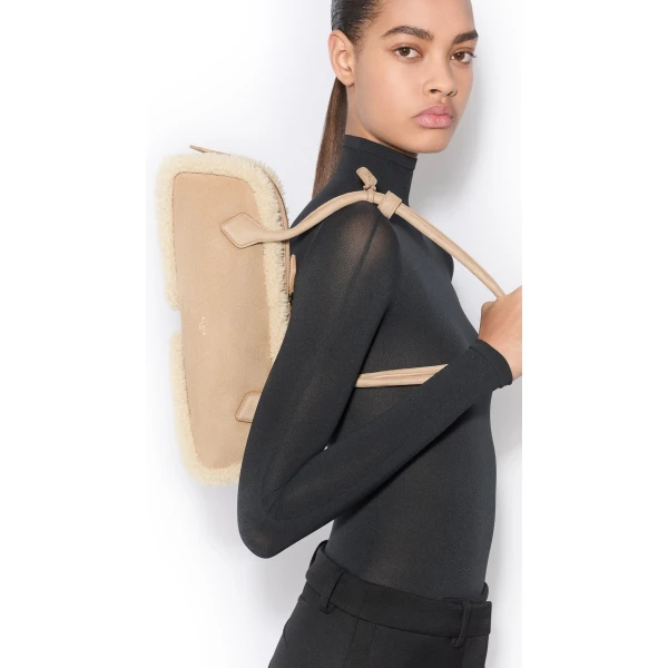 Alaïa Le Teckel Medium Bag In Merino Shearling - Alaia Bags - Laser Cut Luxury - Shop at Coveti