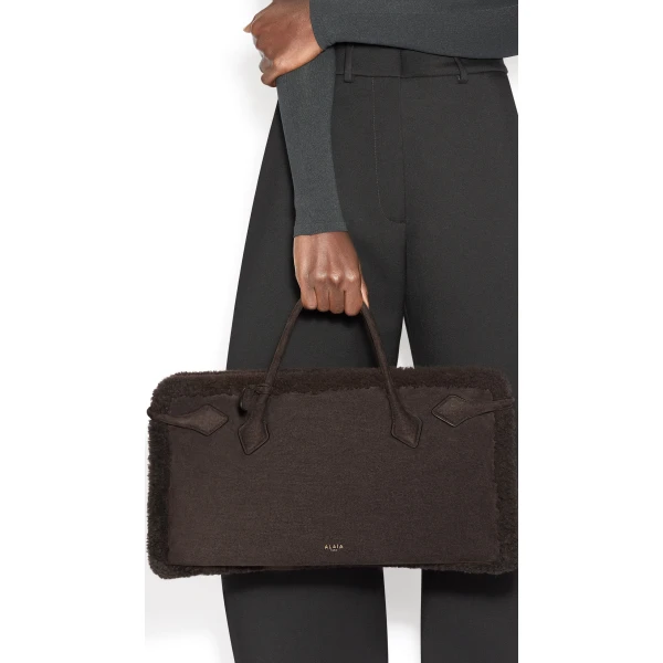 Alaïa Le Teckel Tote Bag In Merino Shearling - Alaia Bags - Laser Cut Luxury - Shop at Coveti