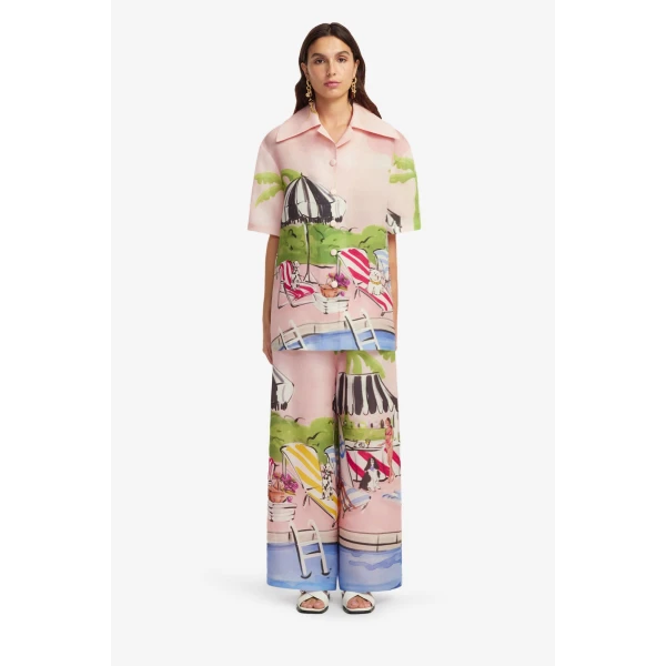 hand-sketched resort scene is a dreamy European holiday in fabric form. Complete with poolside glamour and playful accents