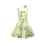 Leo Lin Green Dresses A cascading lilac dream! These beautiful lilac wisteria blooms tumble down a soft lime canvas. This print evokes pure fresh air