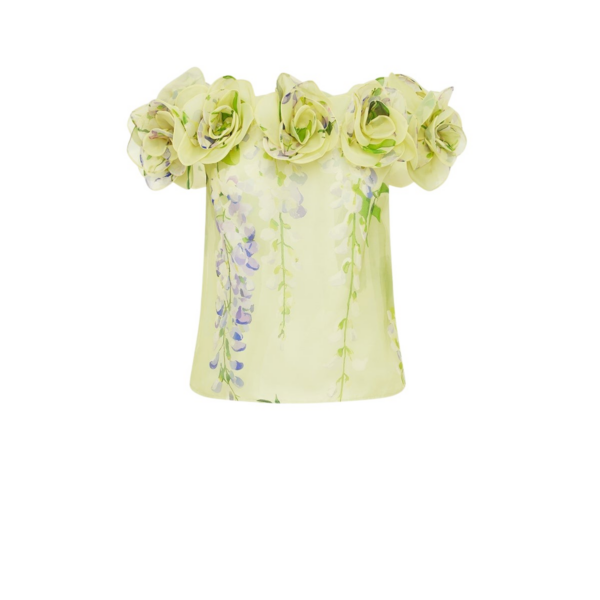 Leo Lin Green Tops A cascading lilac dream! These beautiful lilac wisteria blooms tumble down a soft lime canvas. This print evokes pure fresh air