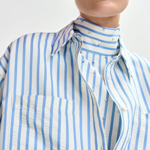 Essentiel Antwerp Light blue and off-white oversized shirt with rhinestone embellishments and layered bib - Essentiel Antwerp Shirts - Colorful Belgian Design - Shop at Coveti