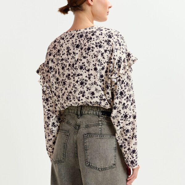 Essentiel Antwerp Off-white and black floral top with ruffle detail - Essentiel Antwerp Tops - Colorful Belgian Design - Shop at Coveti