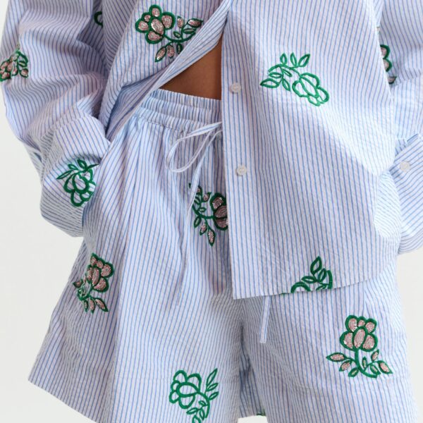 Essentiel Antwerp Off-white cotton mini shorts with light blue pinstriped embroidered with sequin and bead embellishments - Essentiel Antwerp Shorts - Colorful Belgian Design - Shop at Coveti