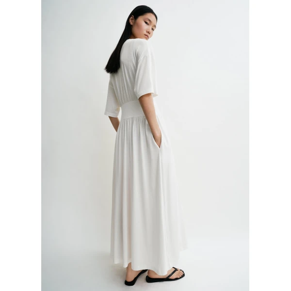 Toteme Dresses with minimalist design at Coveti