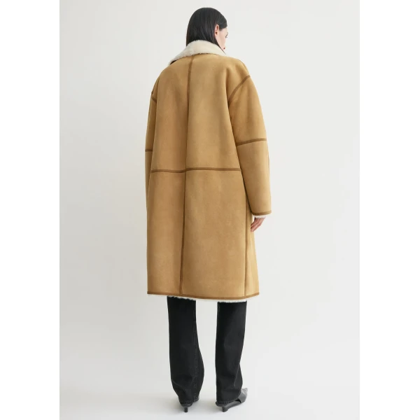 Toteme Coats with minimalist design at Coveti