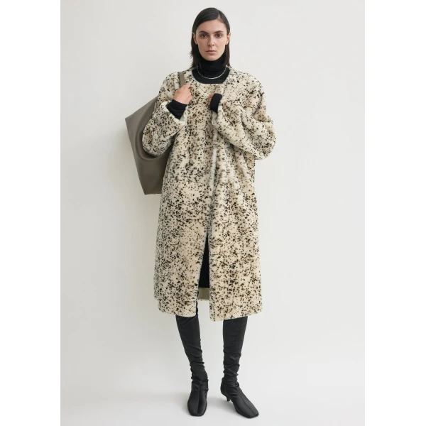 Toteme Coats with minimalist design at Coveti