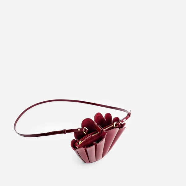 Mlouye Micro Seashell - Patent Bordeaux Bag a Architectural Leather Handbag in Red at Coveti Luxury