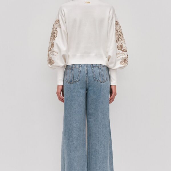 Aje clothing Aus Knitwear – structured silhouette with raw femininity from Coveti