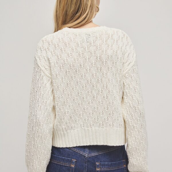 Aje Aus Knitwear – structured silhouette with raw femininity from Coveti