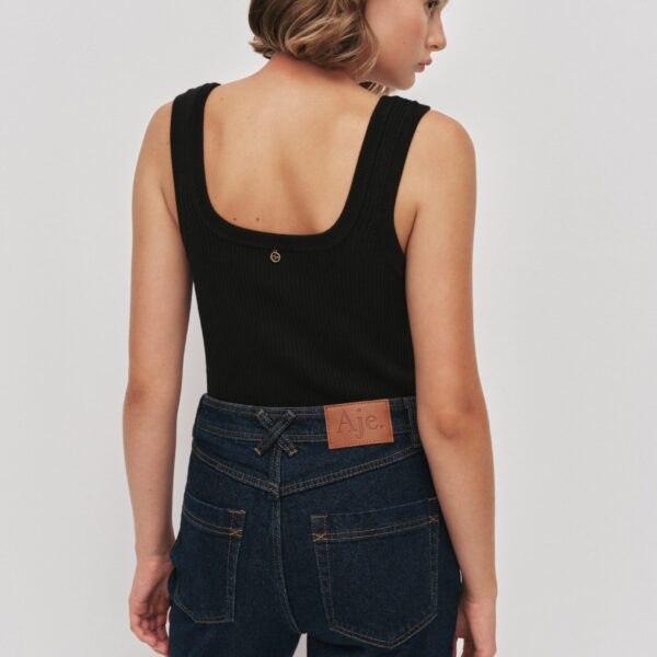 Aje Aus Pants – structured silhouette with raw femininity from Coveti