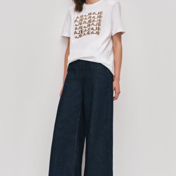 Aje Aus Tops – structured silhouette with raw femininity from Coveti