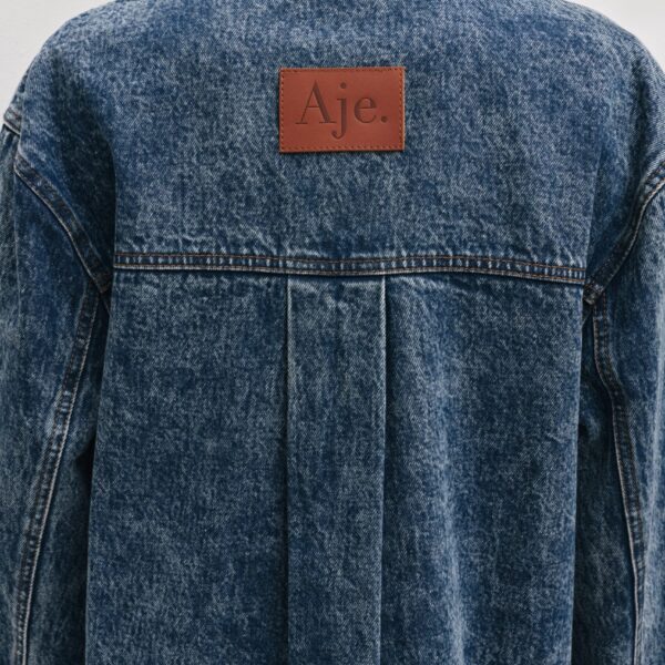 Aje Aus Tops – structured silhouette with raw femininity from Coveti