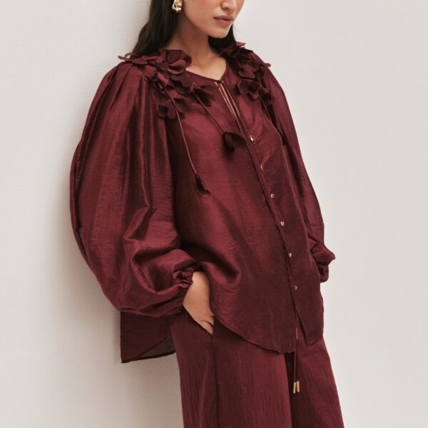 Aje Aus Tops – structured silhouette with raw femininity from Coveti