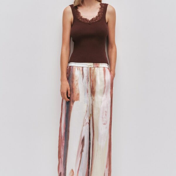 Aje clothing Aus Tops – structured silhouette with raw femininity from Coveti