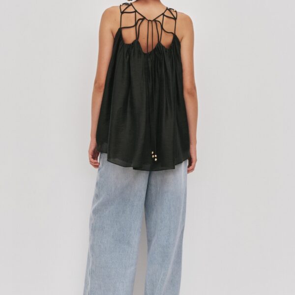 Aje Aus Tops – structured silhouette with raw femininity from Coveti