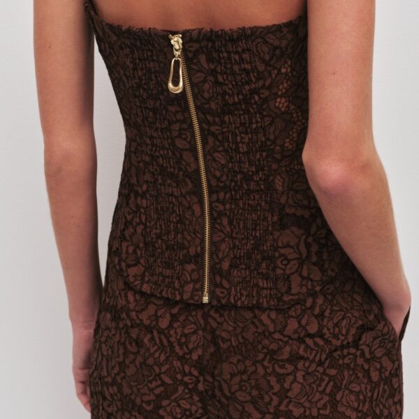 Aje Aus Tops – structured silhouette with raw femininity from Coveti
