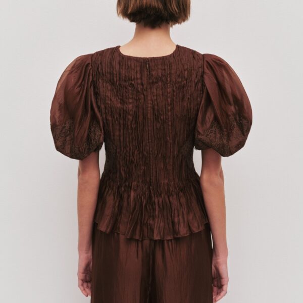 Aje Aus Tops – structured silhouette with raw femininity from Coveti