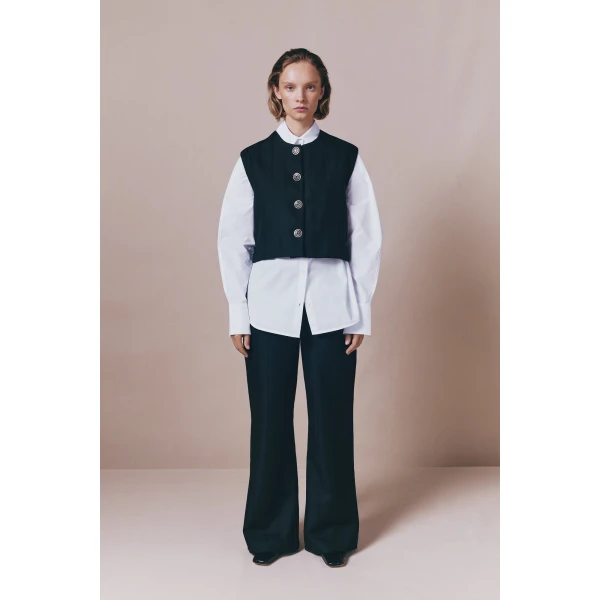 Destree Black buttoned virgin wool sleeveless vest - Destree - Graphic Parisian Fashion - Shop at Coveti