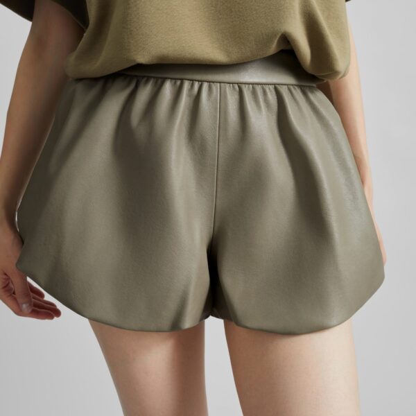 The Frankie Shop Alina Faux Leather Bubble Hem Shorts - Sage - Oversized Minimalist Shorts in Green - Shop at Coveti