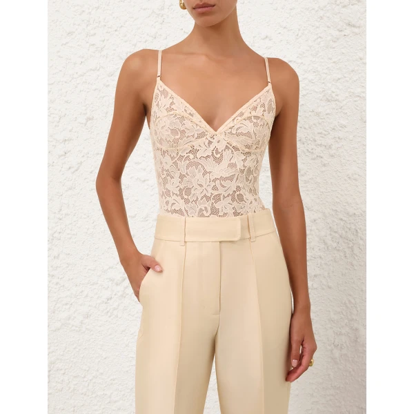 Elevate your elegance in this Zimmermann Bodysuit available now at Coveti