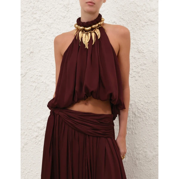 Elevate your elegance in this Zimmermann Tops available now at Coveti
