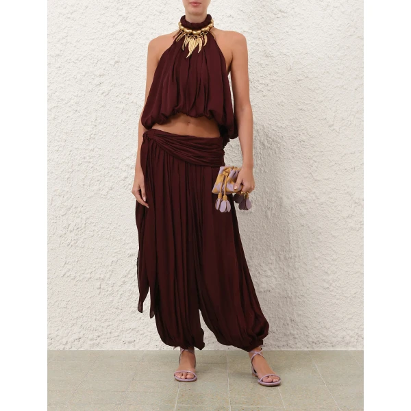 Elevate your elegance in this Zimmermann Tops available now at Coveti