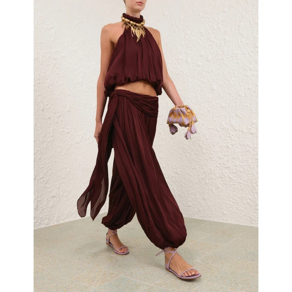 Elevate your elegance in this Zimmermann Tops available now at Coveti