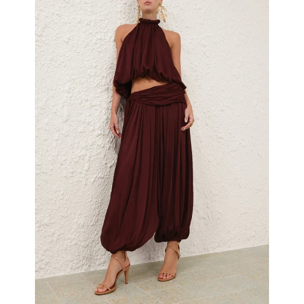 Elevate your elegance in this Zimmermann Tops available now at Coveti