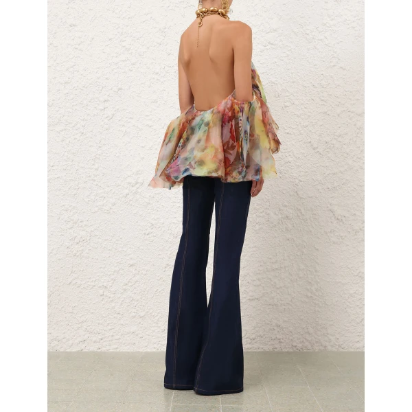 Elevate your elegance in this Zimmermann Tops available now at Coveti