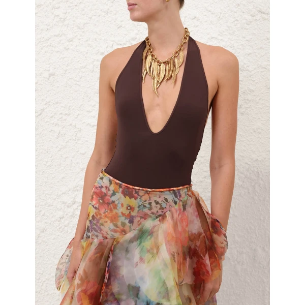 Elevate your elegance in this Zimmermann Bodysuit available now at Coveti