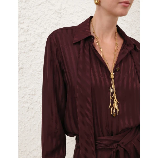 Elevate your elegance in this Zimmermann Tops available now at Coveti