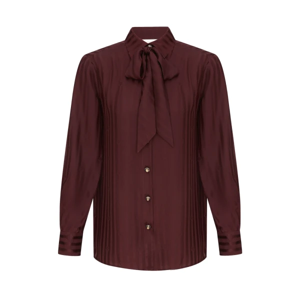 Elevate your elegance in this Zimmermann Tops available now at Coveti