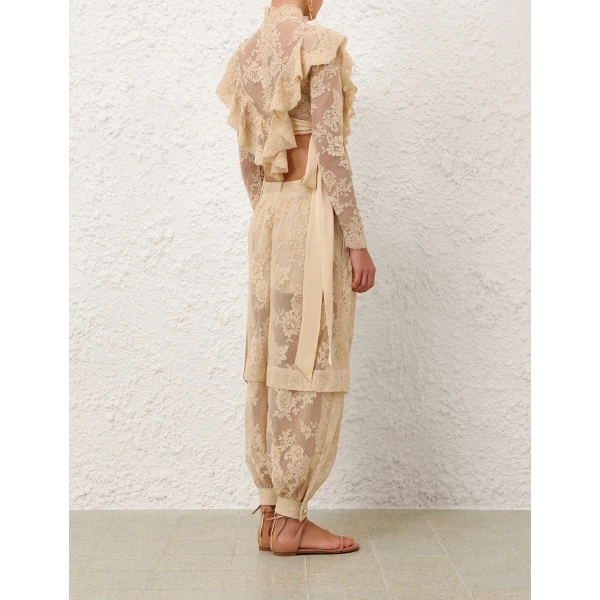 Elevate your elegance in this Zimmermann Tops available now at Coveti
