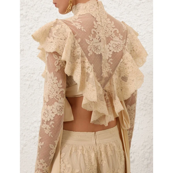 Elevate your elegance in this Zimmermann Tops available now at Coveti