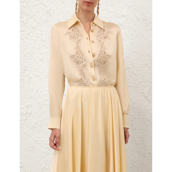 Elevate your elegance in this Zimmermann Tops available now at Coveti